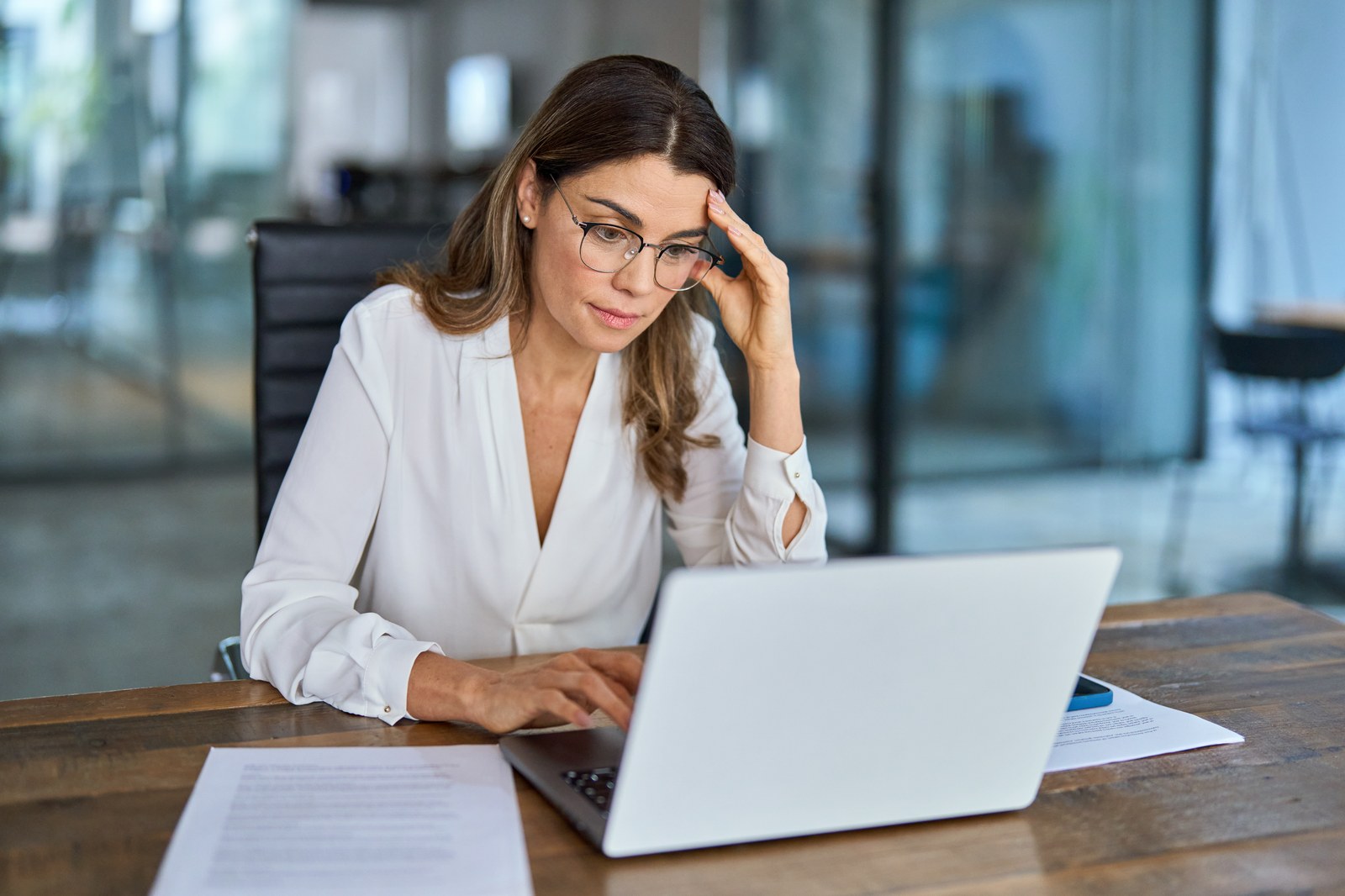Overwhelmed business owner buried in manual admin work